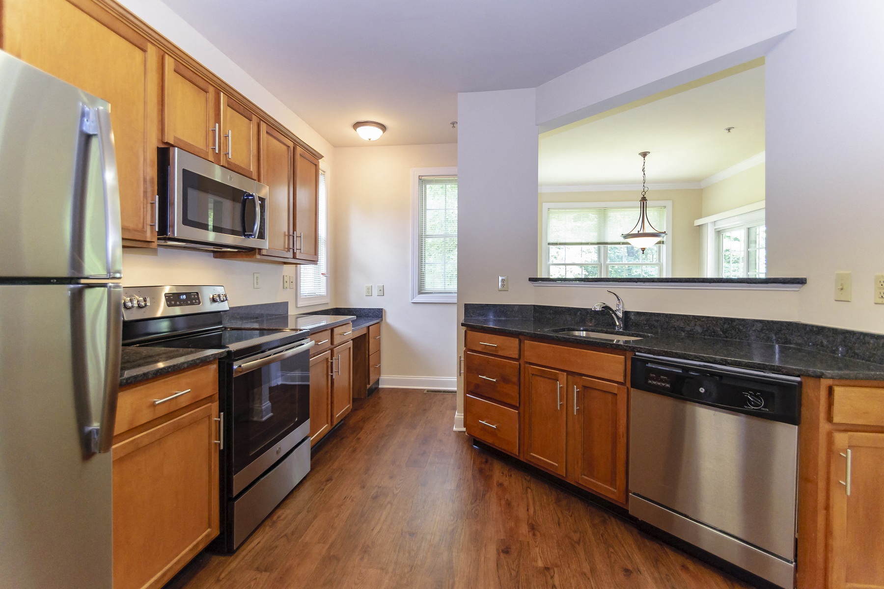 Modern upgraded kitchen featuring sleek appliances and stylish finishes at Claremont Apartments in Exton, PA
